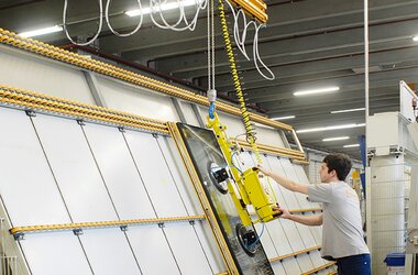 Suspended rail system with electric chain hoist in company EgoKiefer in Switzerland